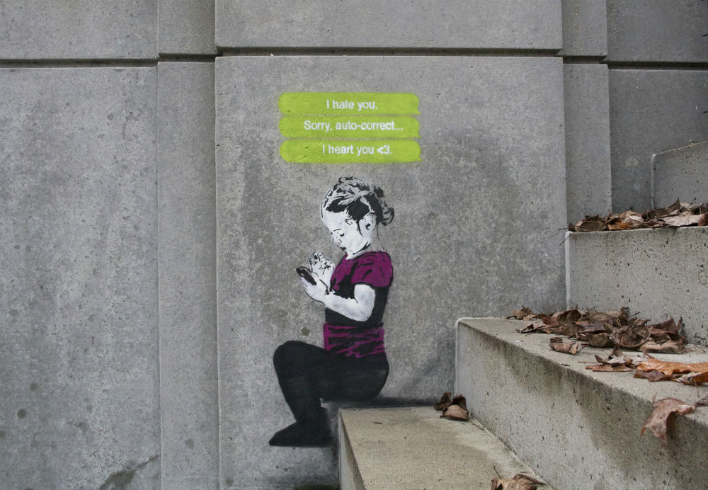 Улични рисунки, показващи пристрастяването към модерните технологии
